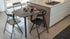 Paddington wooden breakfast table and chairs near a sink.