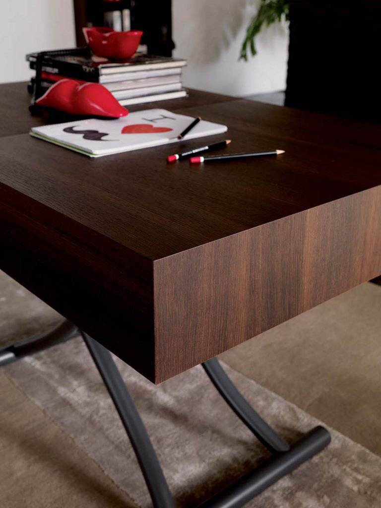 Close up of Box Legno rasing coffee to dining table 