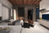 Simplicity Murphy bed setup in a Modern living room with a fireplace, TV, and matching decorative items.